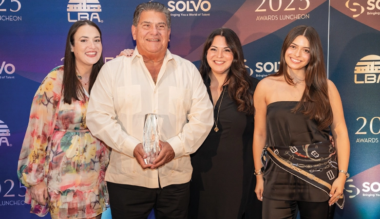 Michele Lopez, Jose Lopez, Monica Lopez, and Mia accepting the Latin Builders Association Business Solutions Company of the Year award