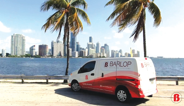 Barlop Business Systems scenic office setting with palm trees and the Miami skyline